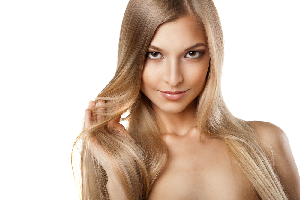 Woman with long straight blond hairs isolated