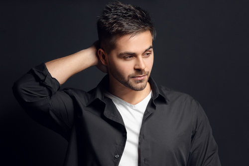 Handsome,Man,With,Stylish,Hairdo,On,Dark,Background