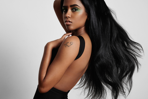 Beauty,Black,Woman,From,The,Side,With,A,Blowing,Hair