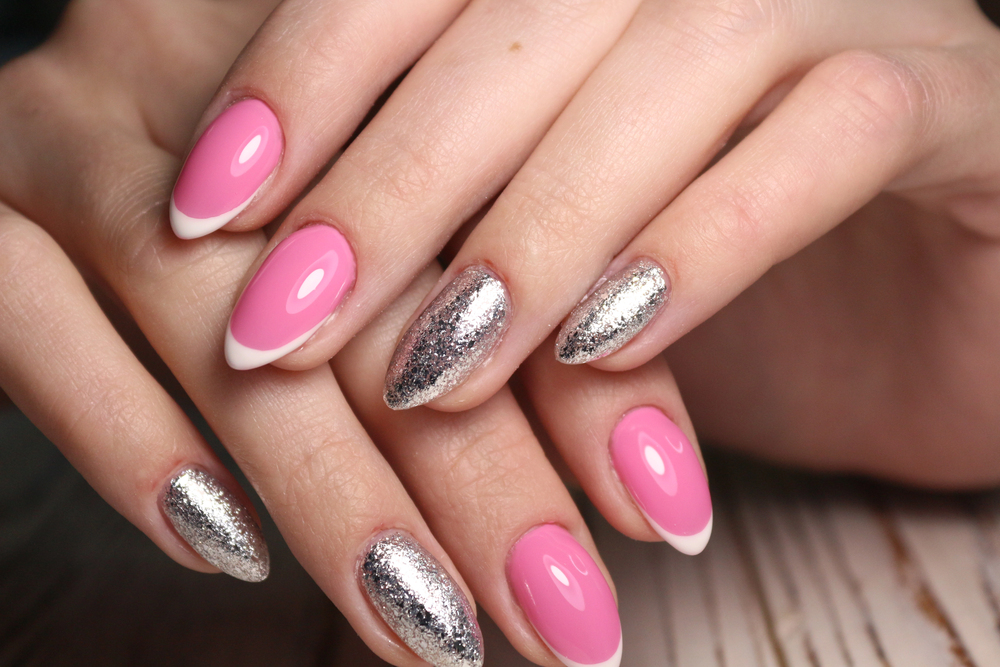 Pink French tip nails with silver glitter accents by Anna's Salon Elite Aliquippa PA