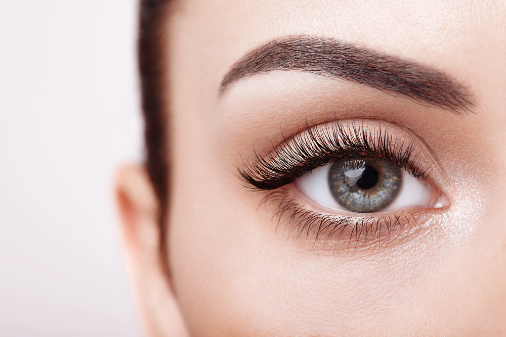 Close-up of defined eyelashes and shaped brows representing lash and brow tinting services in Aliquippa, PA.